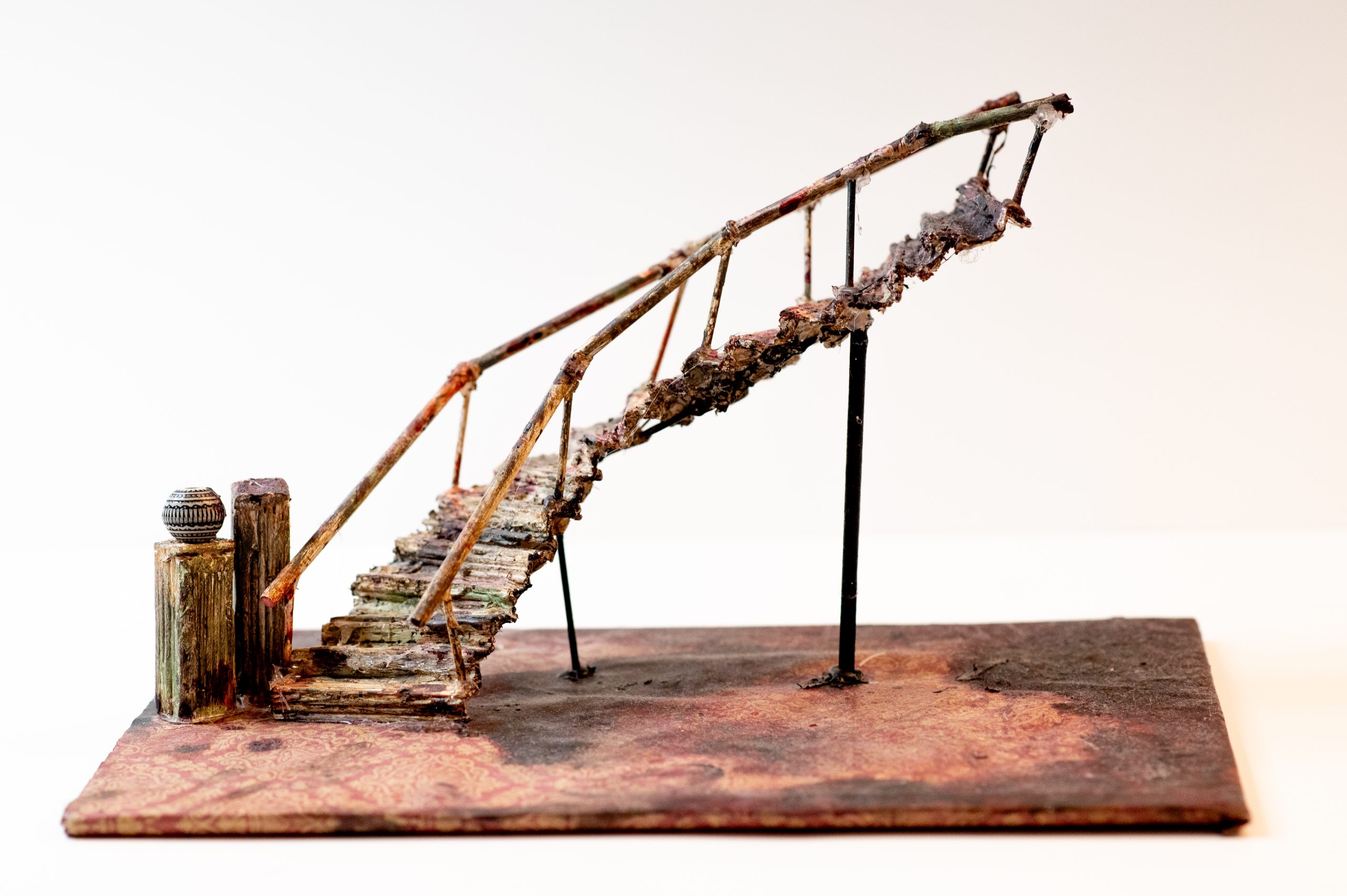 An art project the owner made out of toothpicks to look like a staircase.