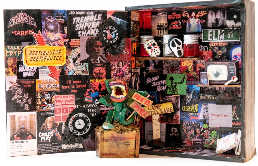 Artwork piece of horror movies made in an old cigar box mix media art.